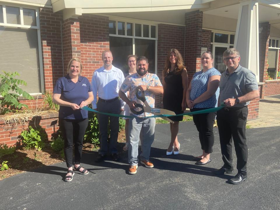 Riley Bacon of Keller Williams Realty is welcomed as a valued member of the Dover Chamber with a ribbon cutting ceremony.
