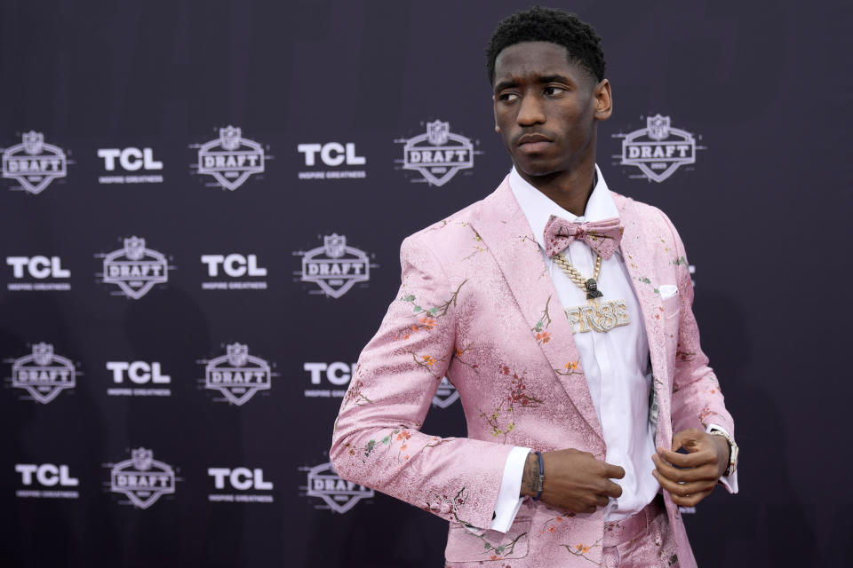 Southern California wide receiver Jordan Addison arrives on the red carpet before the first round of the NFL football draft, Thursday, April 27, 2023, in Kansas City, Mo. (AP Photo/Charlie Riedel)