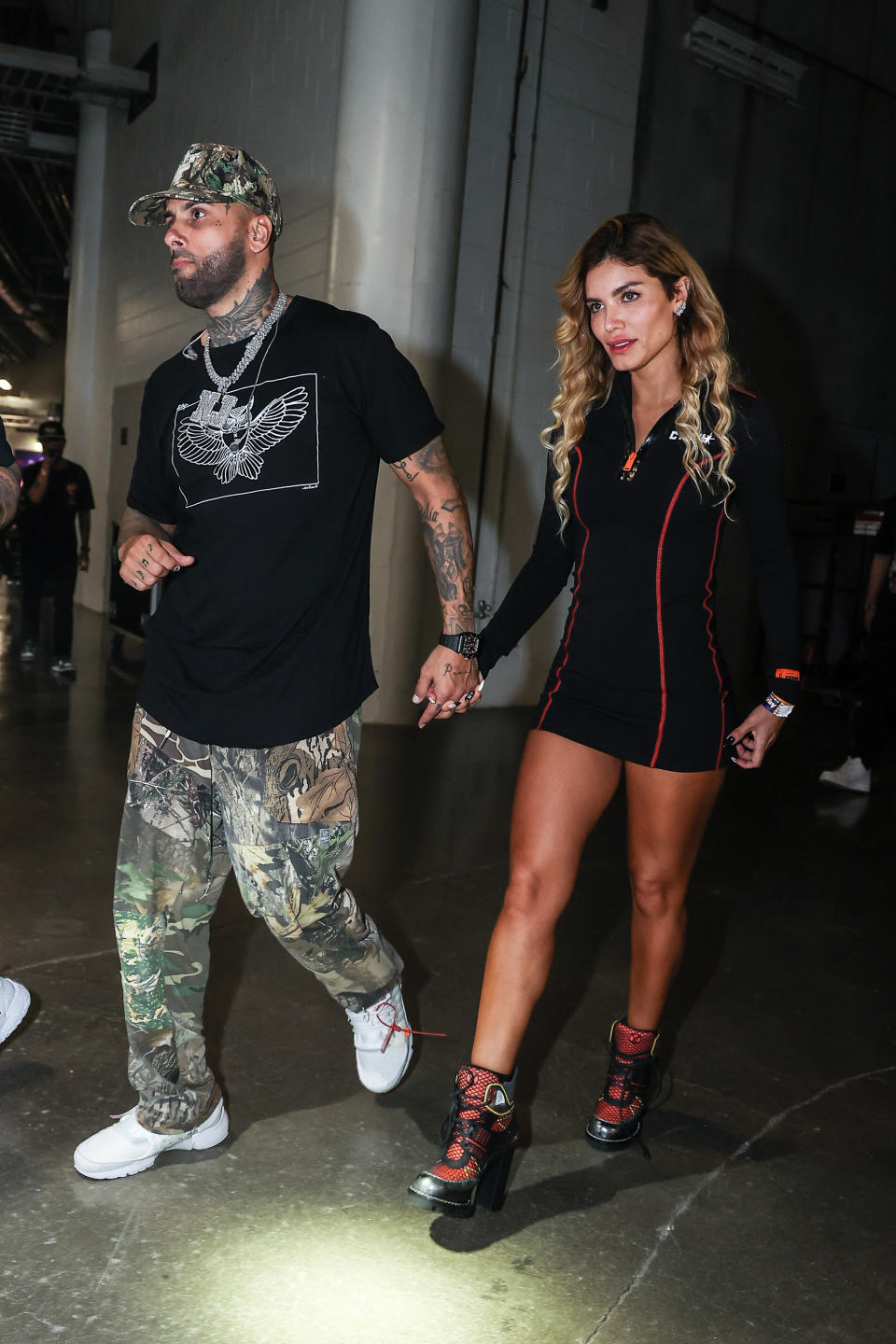 MIAMI, FLORIDA - DECEMBER 17:  Nicky Jams and Génesis Aleska  backstage before she performs at MiamiBash 2021 at FTX Arena on December 17, 2021 in Miami, Florida. (Photo by John Parra/Getty Images,)