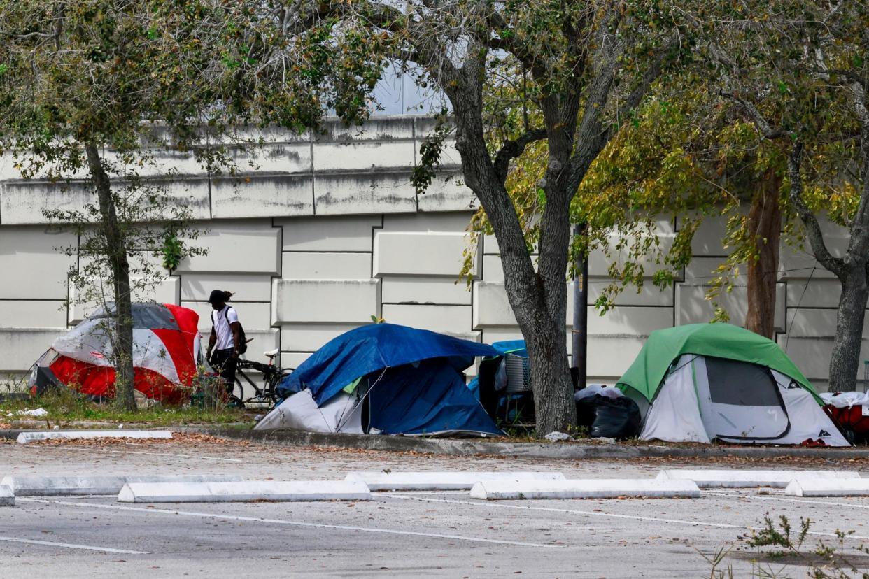 <span>People’s tents in Fort Lauderdale, Florida.</span><span>Photograph: Mike Stocker/South Florida Sun-Sentinel via Getty Images</span>