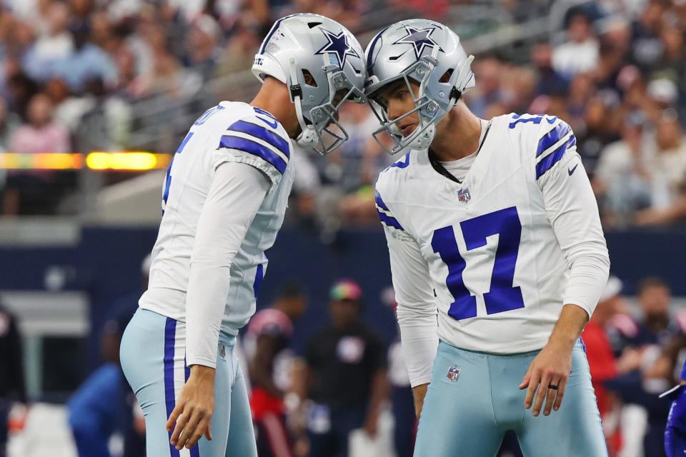 Bryan Anger #5 of the Dallas Cowboys and Brandon Aubrey #17 of the Dallas Cowboys celebrate after Aubrey's field goal during the first quarter against the New England Patriots at AT&T Stadium on October 01, 2023 in Arlington, Texas.