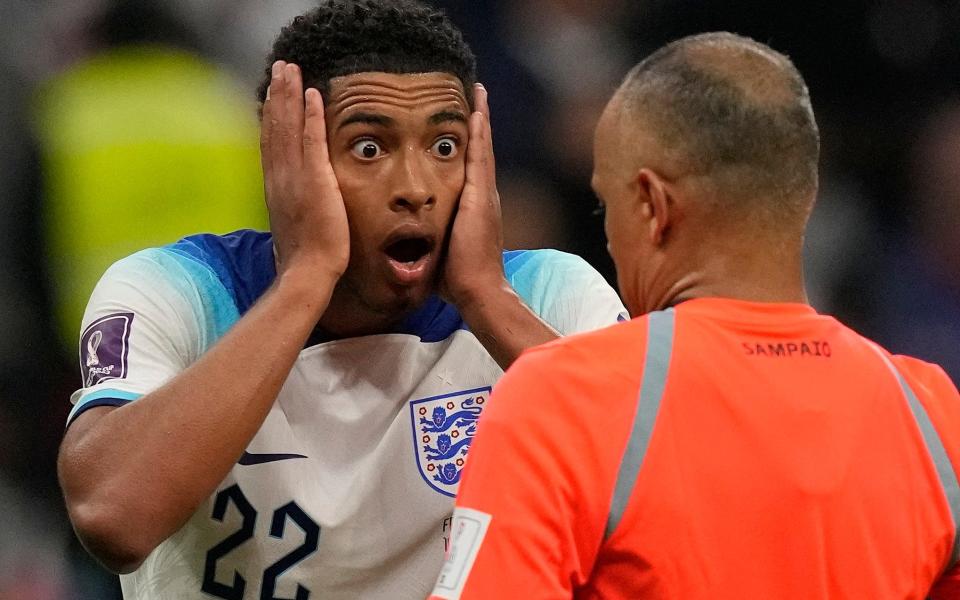 England's Jude Bellingham reacts in front of referee Wilton Sampaio - AP/FRANK AUGSTEIN