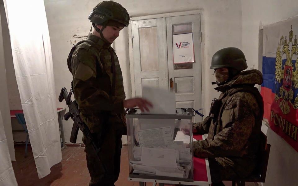 Russian soldiers in the Donetsk People's Republic on Wednesday cast their vote in the presidential elections