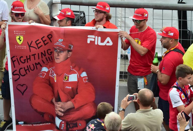 F1 fans in Monza show their support for Michael Schumacher after a skiing accident left him in a coma for six months