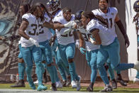 Jacksonville Jaguars players celebrate with wide receiver Jamal Agnew, second from right, after he ran back a missed field goal for a 109-yards for a touchdown against the Arizona Cardinals during the first half of an NFL football game, Sunday, Sept. 26, 2021, in Jacksonville, Fla. (AP Photo/Phelan M. Ebenhack)