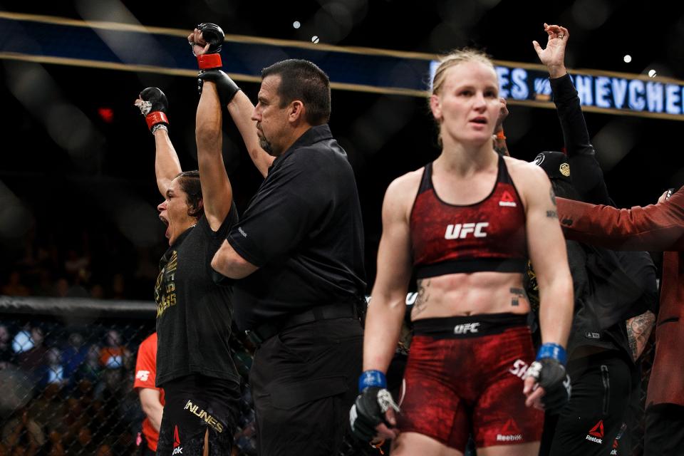 EDMONTON, AB – SEPTEMBER 09: Amanda Nunes, left, reacts after defeating Valentina Shevchenko, right, during UFC 215 at Rogers Place on September 9, 2017 in Edmonton, Canada. (Getty Images)