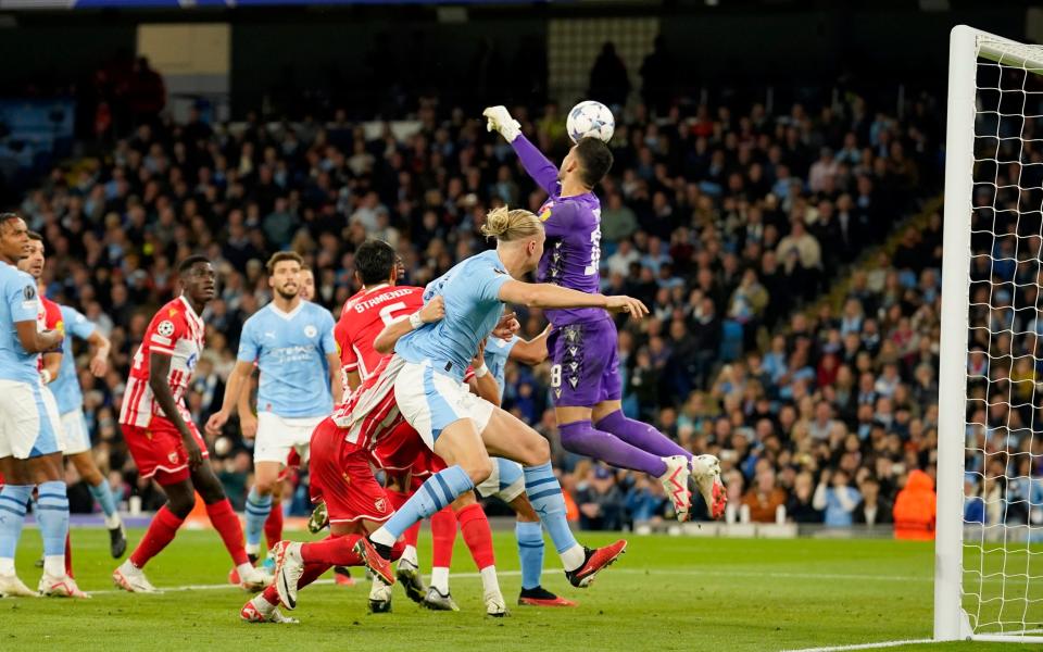 Red Star's goalkeeper Omri Glazer, right, fails to stop Manchester City's Julian Alvarez