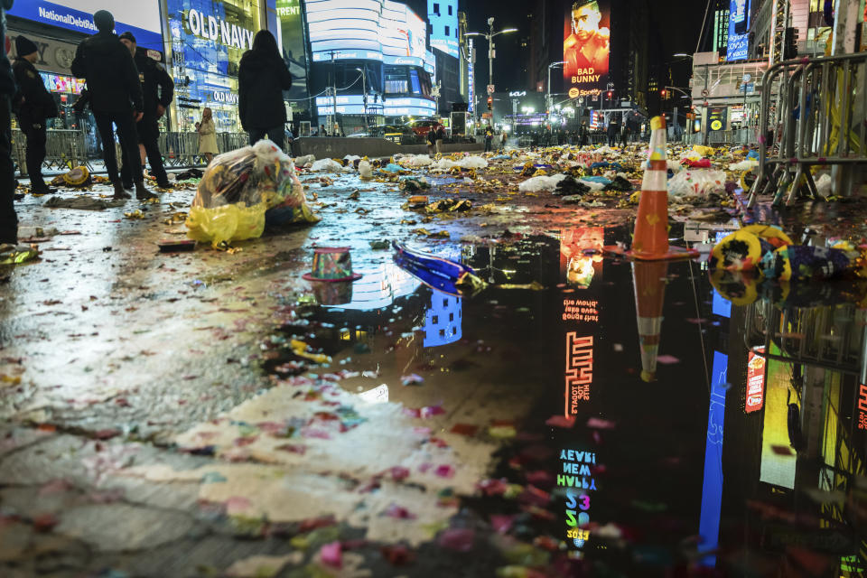 Trash litters New York's Times Square after the New Year's Ball drop and celebration early Sunday, Jan. 1, 2023, in New York. (AP Photo/Stefan Jeremiah)