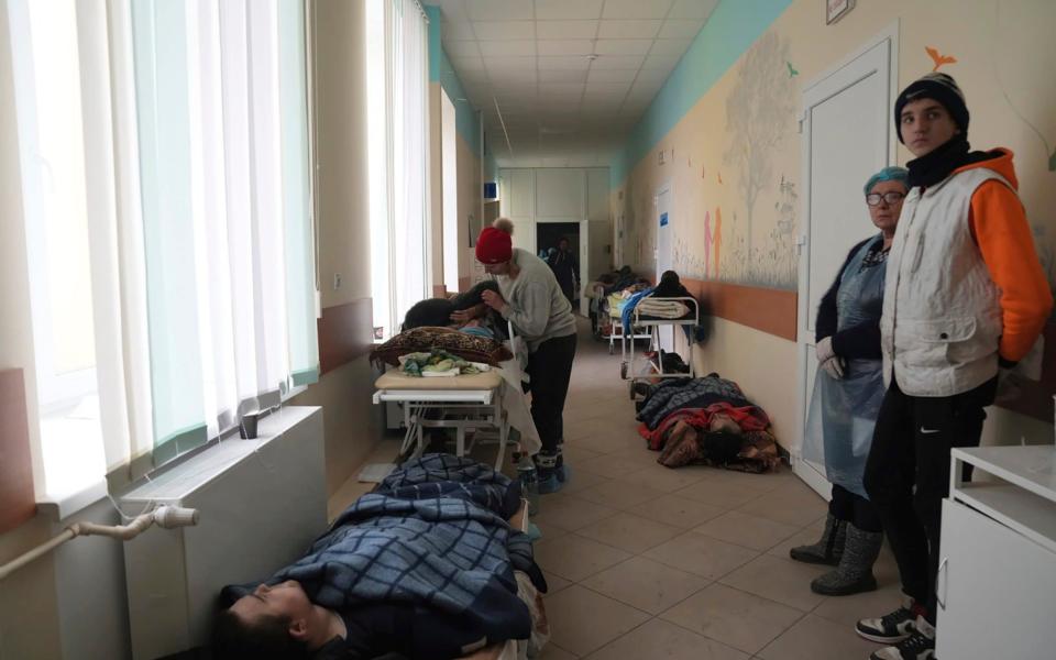 People injured by shelling lay in the hall of hospital number 3 in Mariupol, Ukraine - Evgeniy Maloletka/AP