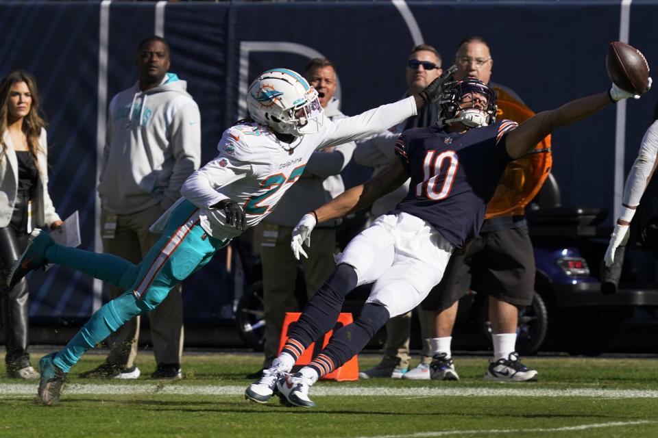 Chicago Bears wide receiver Chase Claypool (10) is unable to catch a pass s Miami Dolphins cornerback Keion Crossen (27) blocks during the first half of an NFL football game, Sunday, Nov. 6, 2022 in Chicago. Crossen was charged with pass interference. (AP Photo/Nam Y. Huh)