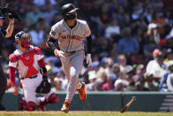 San Francisco Giants' Jung Hoo Lee watches his fly out to center during the third inning of a baseball game against the Boston Red Sox at Fenway Park, Thursday, May 2, 2024, in Boston. (AP Photo/Charles Krupa)