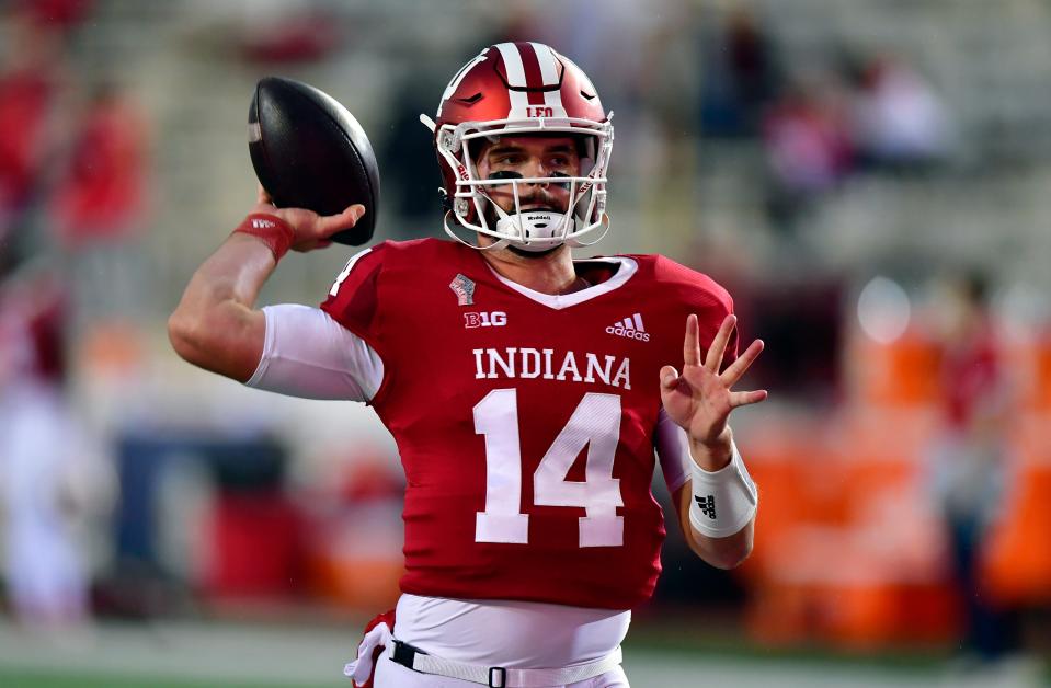 Indiana Hoosiers quarterback Jack Tuttle (14) warms up before a game against the Ohio State Buckeyes at Memorial Stadium.