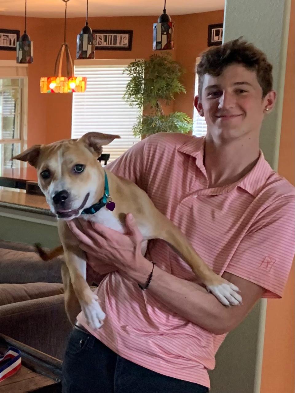 Cameron Stewart with his dog named Bailey. Stewart died at age 19 in his Leander apartment in 2021 after taking a counterfeit pill laced with fentanyl.