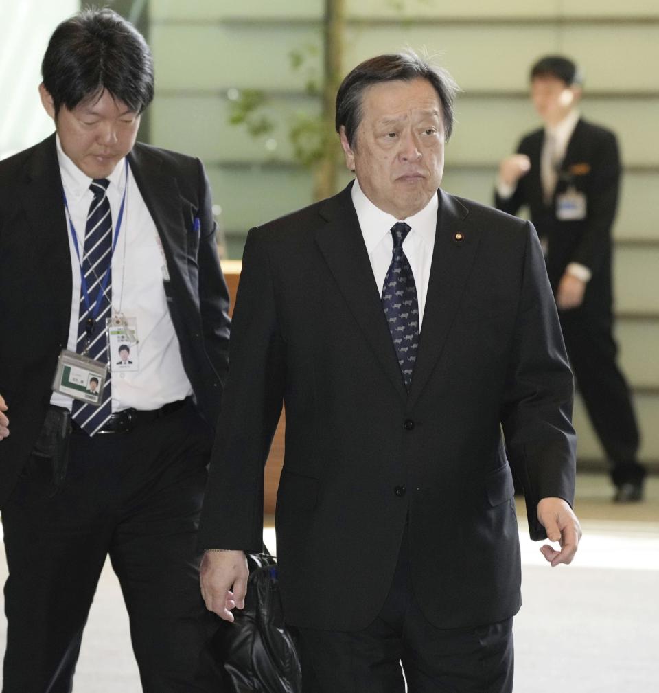 Japanese Defense Minister Yasukazu Hamada, right, arrives at the prime minister's official office in Tokyo, Thursday, April 13, 2023, after North Korea launched a ballistic missile toward the sea between the Korean Peninsula and Japan on Thursday. Hamada told reporters that North Korea launched a possible intercontinental ballistic missile on a high angle. Hamada said the missile did not reach Japan's exclusive economic zone.(Kyodo News via AP)