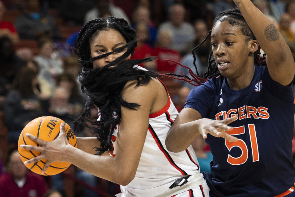 Georgia's Malury Bates is defended by Auburn's Precious Johnson (51) during the first half of an NCAA college basketball game in the Southeastern Conference women's tournament in Greenville, S.C., Thursday, March 2, 2023. (AP Photo/Mic Smith)