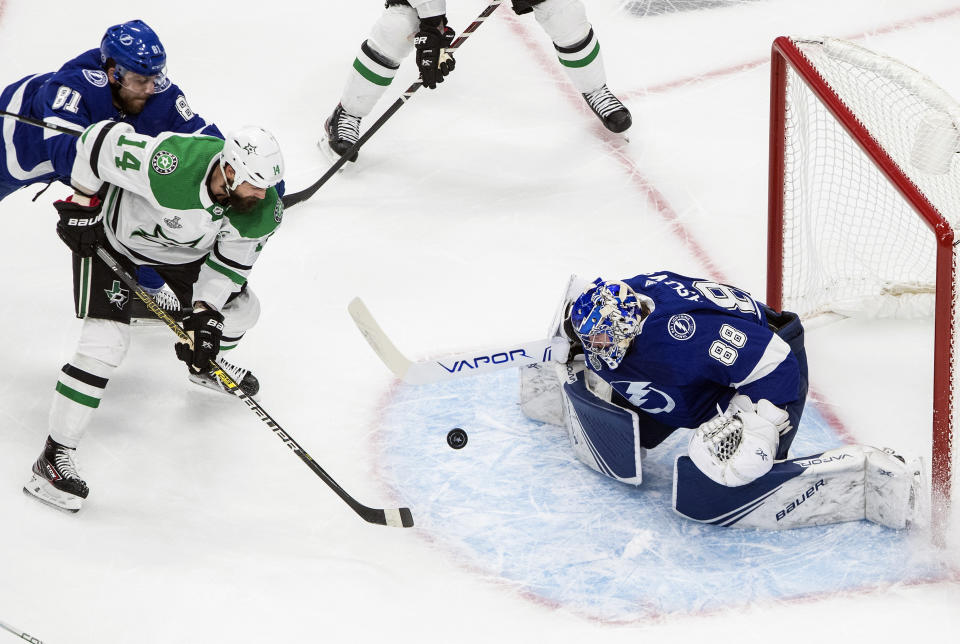 Dallas Stars' Jamie Benn (14) is stopped by Tampa Bay Lightning goalie Andrei Vasilevskiy (88) during first-period NHL Stanley Cup finals hockey action in Edmonton, Alberta, Monday, Sept. 21, 2020. (Jason Franson/The Canadian Press via AP)