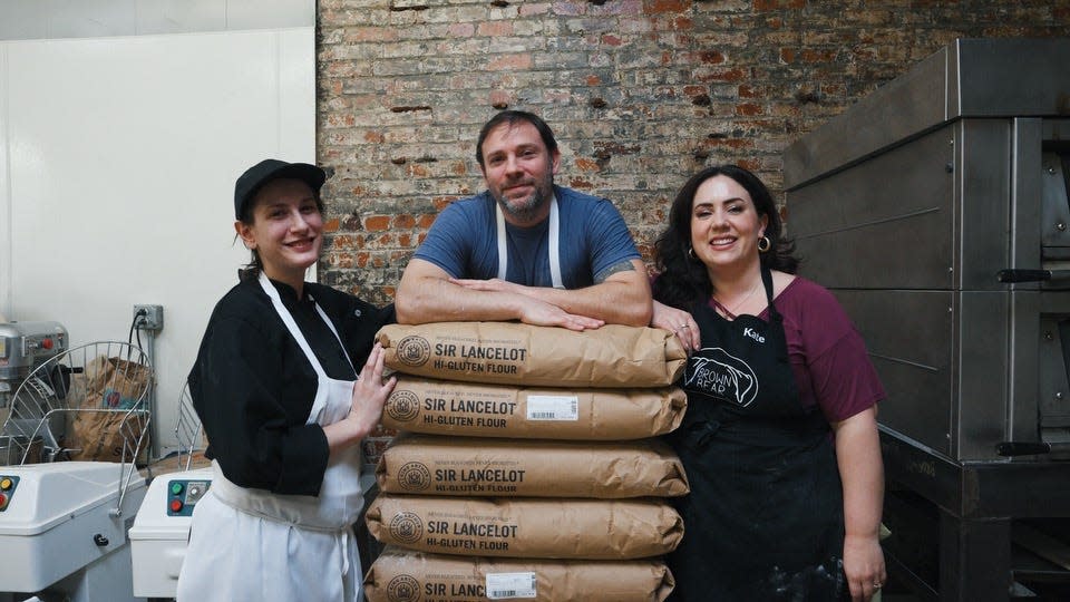 The staff of Brown Bear Bread Cafe, which is moving operations to New Brighton.
