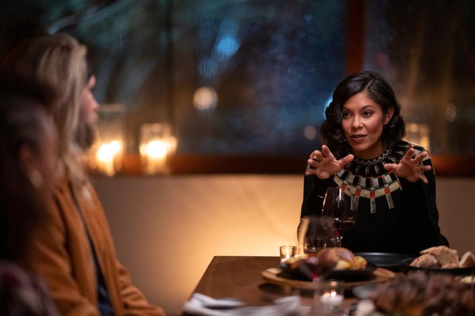 Alex Wagner talks with contestants on "The Mole," a reboot of the reality series that begins on Netflix Oct. 7, 2022.