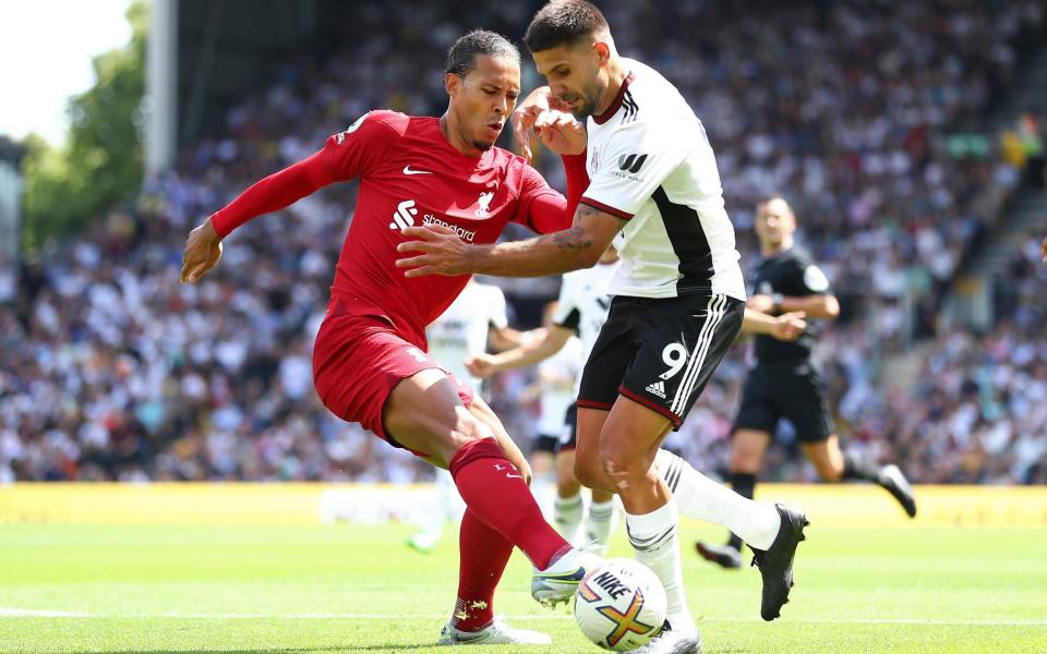 Virgil van Dijk concedes a penalty against Fulham's Aleksandar Mitrovic - GETTY IMAGES