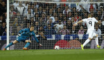 Real's Karim Benzema scores the opening goal past Bayern goalkeeper Manuel Neuer during a first leg semifinal Champions League soccer match between Real Madrid and Bayern Munich at the Santiago Bernabeu stadium in Madrid, Spain, Wednesday, April 23, 2014. (AP Photo/Andres Kudacki)