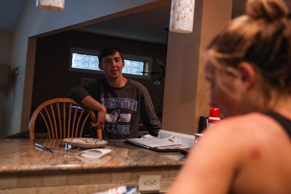 Will Rhodunda chats with his sister Alexa in their Wilmington, Del., home June 12.