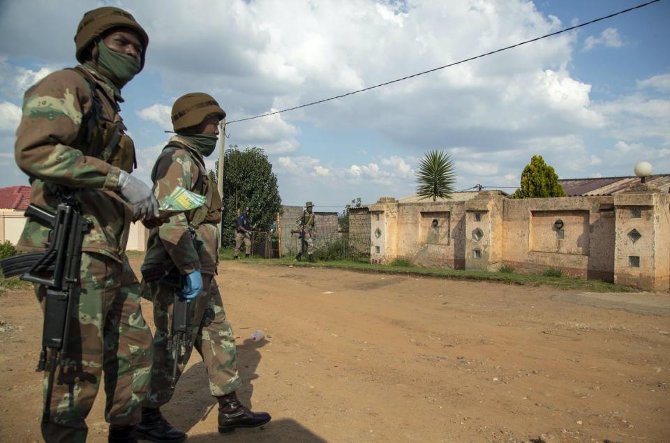 Soldiers patrol the streets of Soweto, a township in Johannesburg, during a lockdown instated to combat the spread of the coronavirus. (AP Photo/Themba Hadebe)