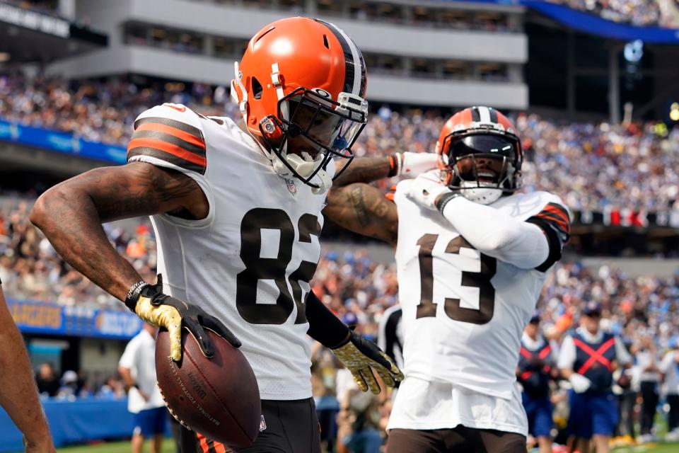 Cleveland Browns wide receiver Rashard Higgins (82) celebrates his touchdown catch with wide receiver Odell Beckham Jr. (13) during the first half of an NFL football game against the Los Angeles Chargers Sunday, Oct. 10, 2021, in Inglewood, Calif. (AP Photo/Gregory Bull)