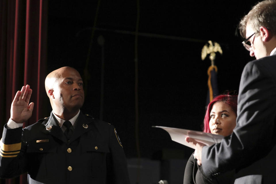 FILE - In this Sept. 8, 2017, file photo, newly appointed Minneapolis Police Chief Medaria Arradondo takes the oath of office as his daughter Nyasia looks on during a public swearing-in ceremony, in Minneapolis. George Floyd’s death and the protests it ignited nationwide over racial injustice and police brutality have raised questions about whether Arradondo — or any chief — can fix a department that's now facing a civil rights investigation. (Anthony Souffle/Star Tribune via AP, File)