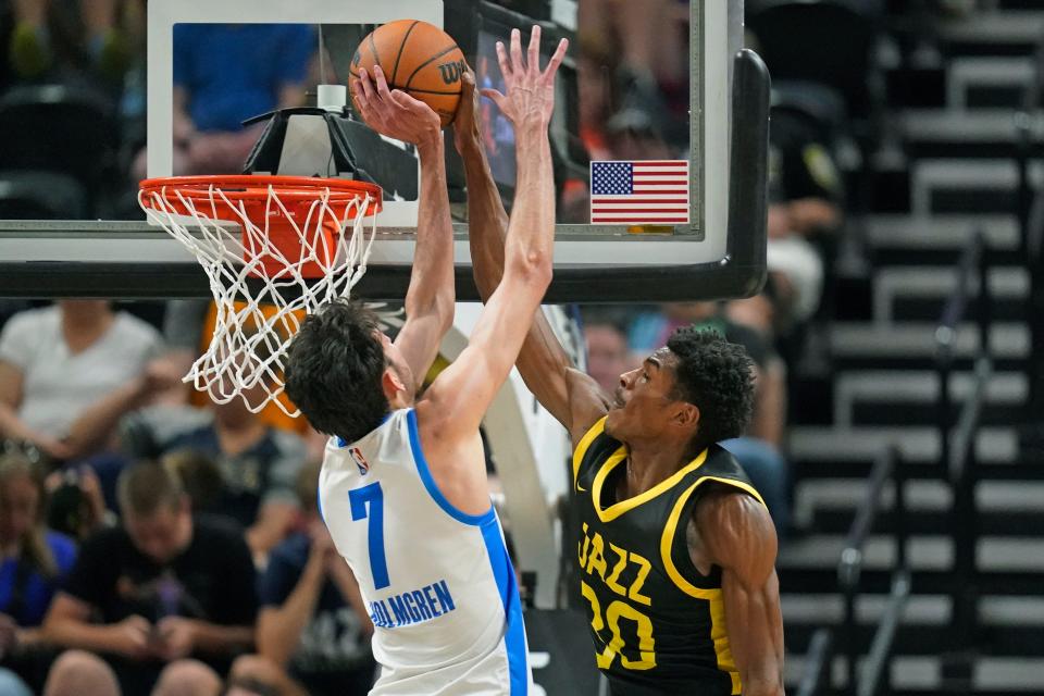 Thunder forward Chet Holmgren (7) blocks a shot by Jazz guard Ochai Agbaji (30) in the first half Monday.