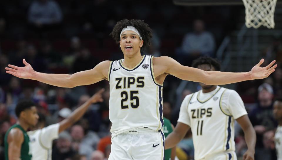 Akron forward Enrique Freeman celebrates as the Zips lead during the second half in the MAC Tournament semifinals Friday in Cleveland.