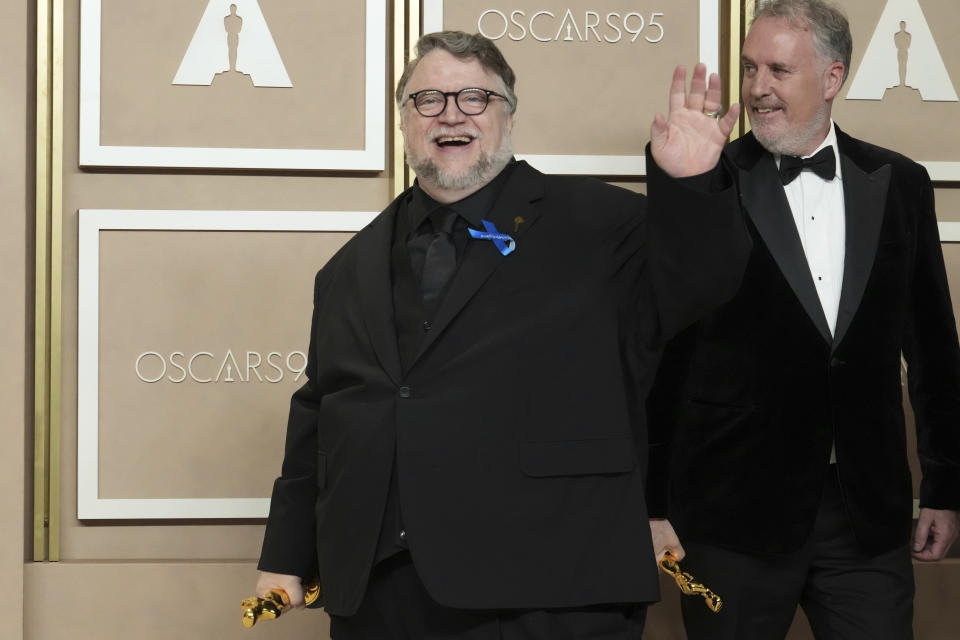 Guillermo de Toro, left, and Mark Gustafson, winners of the award for best animated feature film for "Guillermo del Toro's Pinocchio," pose in the press room at the Oscars on Sunday, March 12, 2023, at the Dolby Theatre in Los Angeles. (Photo by Jordan Strauss/Invision/AP)
