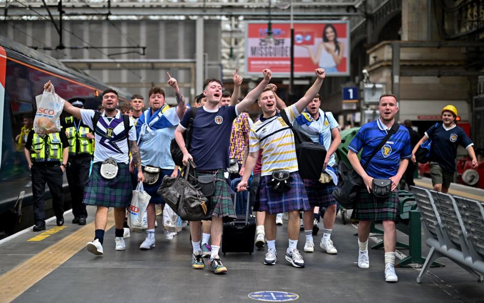 Scotland fans prepare to board the train down to London - GETTY IMAGES