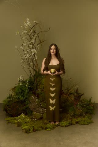 <p>Courtesy Boy Smells</p> Kacey Musgraves holds her "Deeper Well" candle, her second collaboration with Boy Smells, inspired by her new album of the same name.