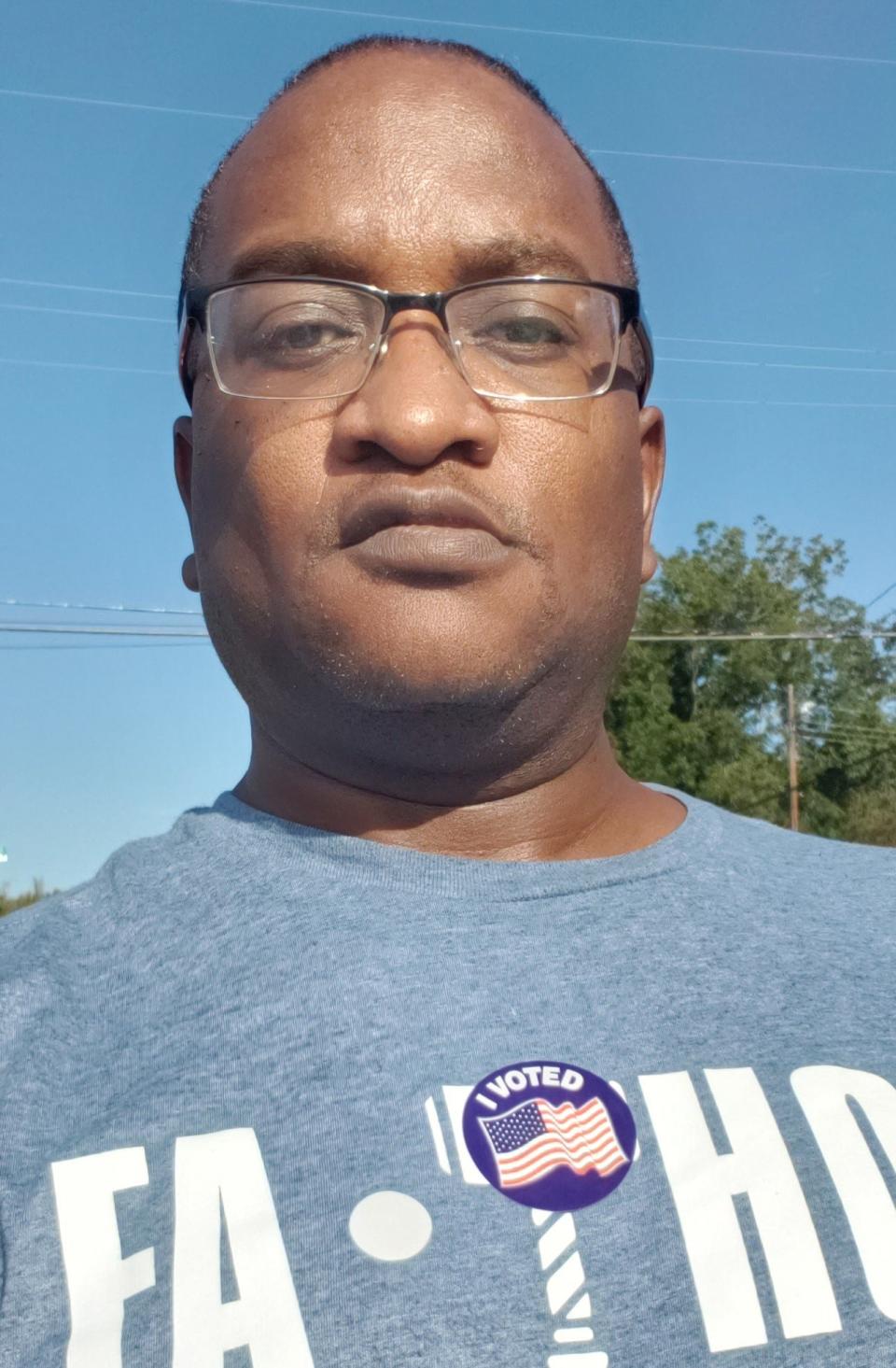 Myron Pitts shows off his I Voted sticker after voting in the primary election for Fayetteville City Council on Tuesday, Oct. 10, 2023.