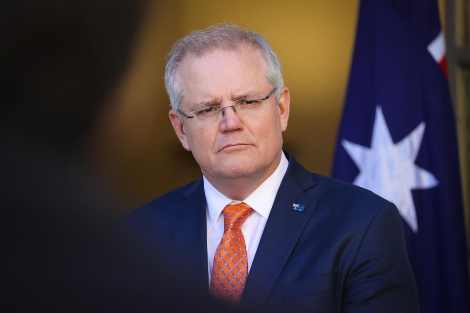 CANBERRA, AUSTRALIA - JULY 9: Australian Prime Minister Scott Morrison listens to a question during a media conference at Parliament House on July 9, 2020 in Canberra, Australia. Australia has suspended its extradition policy with Hong Kong in light of recent changes to security laws. Australia will also offer visas for residents of Hong Kong to apply for residency in Australia. (Photo by David Gray/Getty Images)