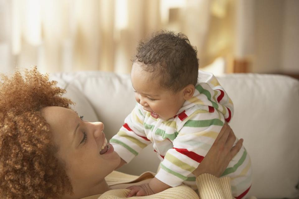 Mom smiling at baby