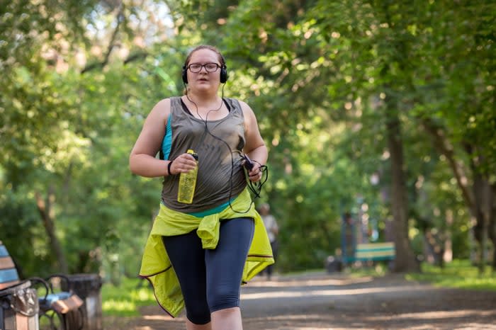 A woman running in the park. 