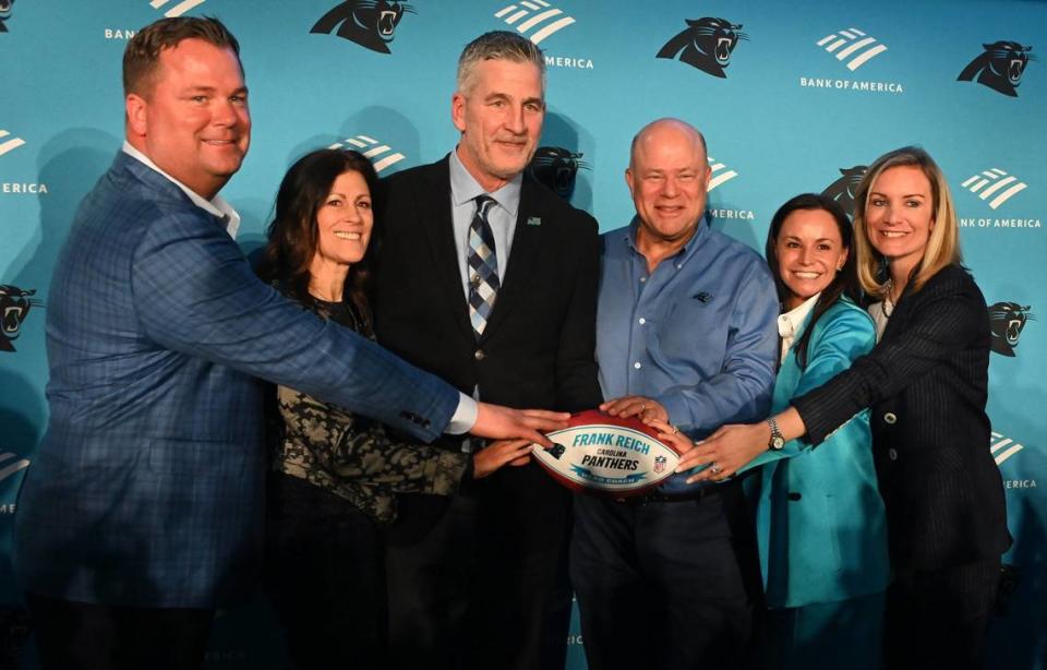 (L-R) Carolina Panthers general manager Scott Fitterer, Linda Reich, new Carolina Panthers head coach Frank Reich, team owners David and Nicole Tepper and team president Kristi Coleman pose for photographs following Frank Reich’s introductory press conference at Bank of America Stadium on Tuesday, January 31, 2023.