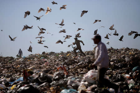 A man runs at 'Lixao da Estrutural', Latin America's largest rubbish dump, in Brasilia, Brazil, January 19, 2018. REUTERS/Ueslei Marcelino TPX IMAGES OF THE DAY