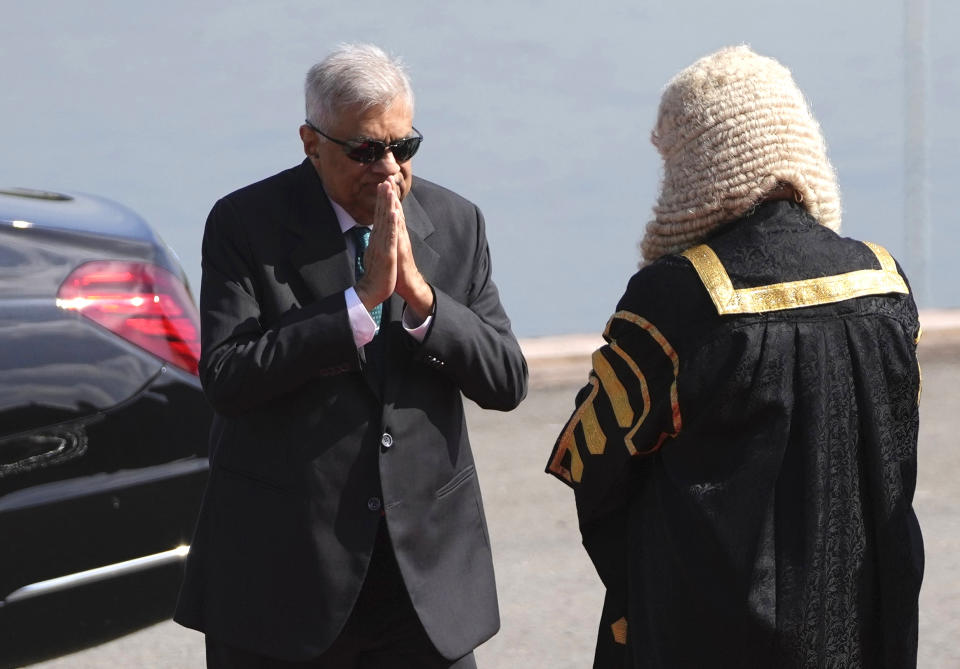 Sri Lankan president Ranil Wickremesinghe, left, greets speaker Mahinda Yapa Abeywardena as he arrives at the parliament to deliver his policy speech in Colombo, Sri Lanka, Wednesday, Feb. 8, 2023. Sri Lanka's president said Tuesday that China has given crucial debt restructuring assurances that mean the bankrupt Indian Ocean nation could get its $2.9 billion bailout package approved soon. (AP Photo/Eranga Jayawardena, file)