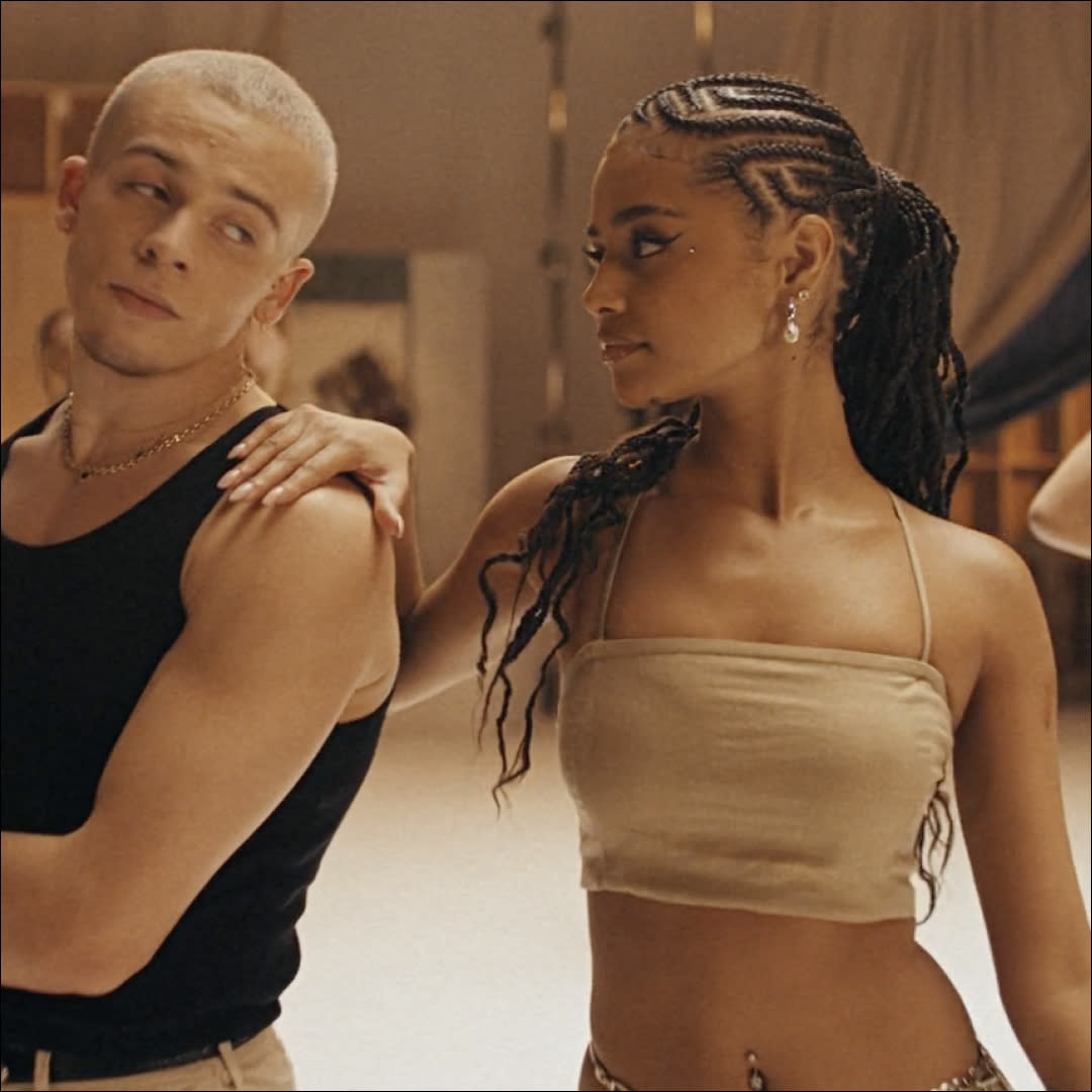  Tyla poses with a dancer in a GAP campaign video while wearing a linen crop top. 