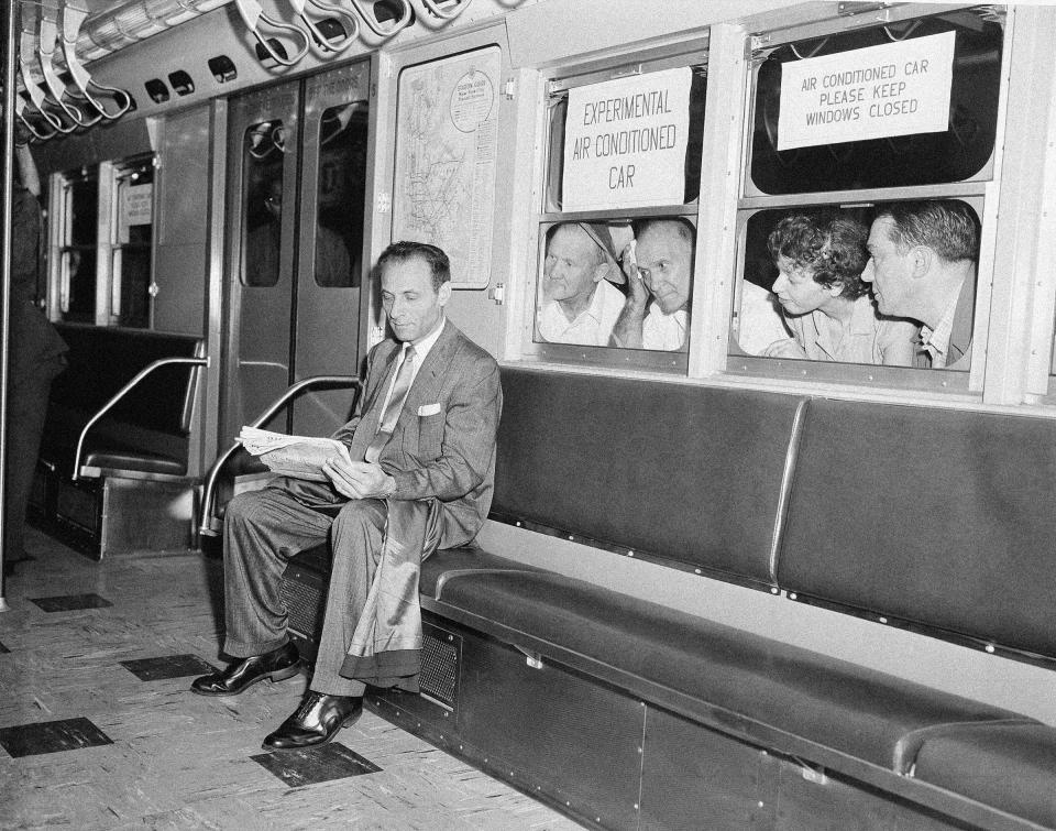 While other subway passengers perspire in the warm and humid underground station, Paul Forman appears cool and comfortable in the experimental air conditioned train, which made its first run in New York City, in July 1956. The test run included six air conditioned cars and two old cars. When the train left Grand Central Station, the temperature was 89 degrees in the old cars, while the new cars registered a temperature of 76.5 degrees.<span class="copyright">Harry Harris—AP</span>