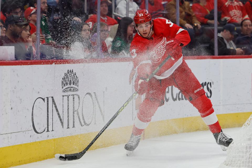 Red Wings defenseman Moritz Seider skates with the puck in the first period on Monday, April 10, 2023, at Little Caesars Arena.