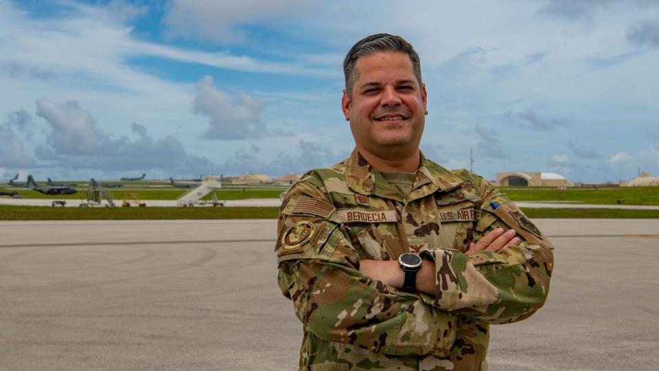 U.S. Air Force Col. Carlos Berdecía, who served as 437th Air Expeditionary Wing commander during the Mobility Guardian exercise, poses in front of the flightline at Andersen Air Force Base, Guam, July 18. (Airman 1st Class Caleb Parker/Air Force)