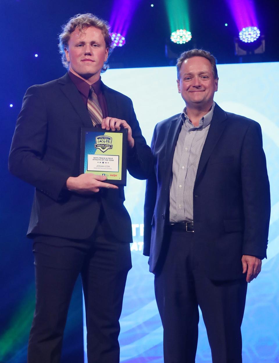 Manchester High's Josiah Cox Greater Akron Boys Track and Field Player of the Year with Michael Shearer Akron Beacon Journal editor at the High School Sports All-Star Awards at the Civic Theatre in Akron on Friday.