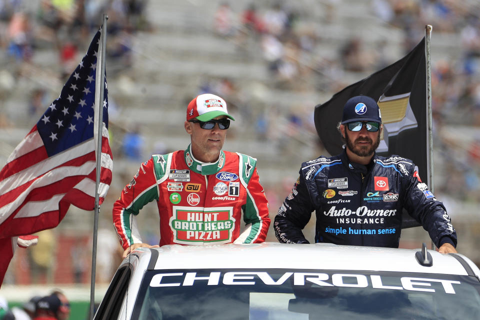 ATLANTA, GA - JULY 10: Kevin Harvick (#4 Stewart Haas Racing Hunt Brothers Pizza Ford) and Martin Truex Jr (#19 Joe Gibbs Racing Auto-Owners Insurance Toyota) during driver intros before the 53rd Annual Quaker State 400 NASCAR race on July 10, 2022 at the Atlanta Motor Speedway in Hampton, Georgia.  (Photo by David J. Griffin/Icon Sportswire via Getty Images)