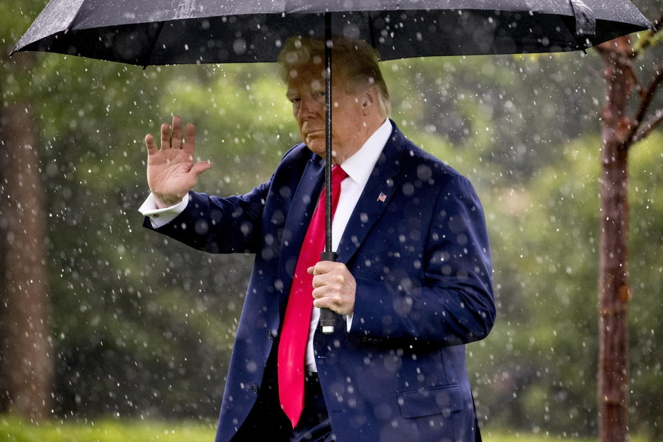 President Donald Trump waves to members of the media as he walks across the South Lawn of the White House in Washington, Thursday, June 11, 2020, before boarding Marine One for a short trip to Andrews Air Force Base, Md., and then on to Dallas for a fundraiser. (AP Photo/Andrew Harnik)