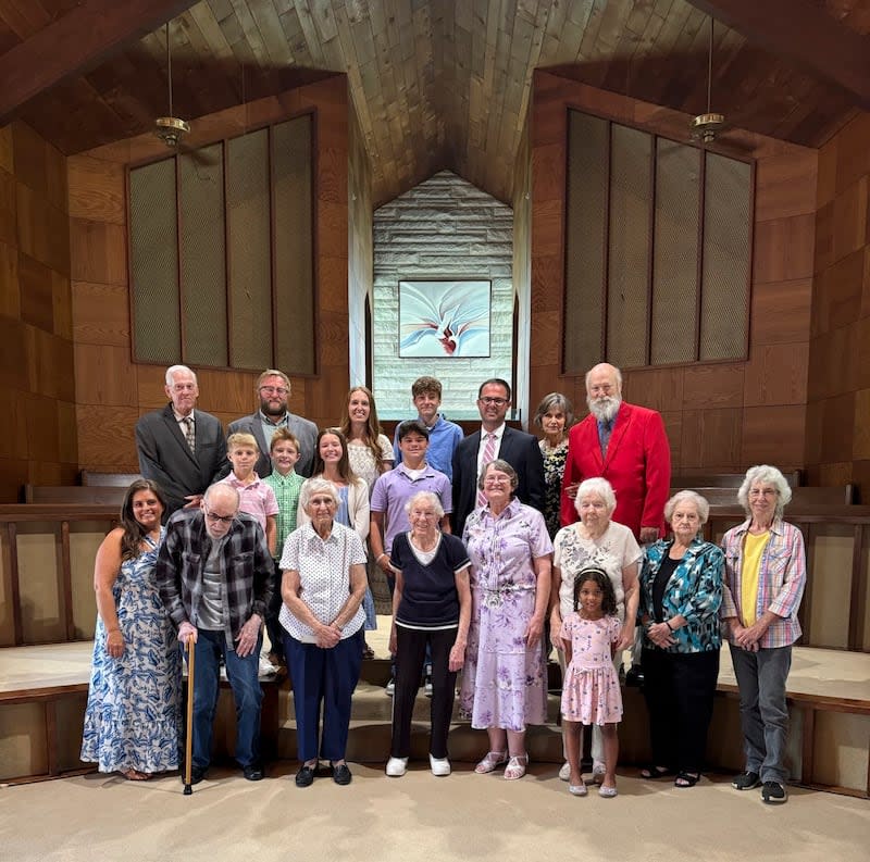 Ryan Burge poses for a photograph with members of First Baptist Church of Mount Vernon, Ill., at the church on July 21, 2024. | Patty King