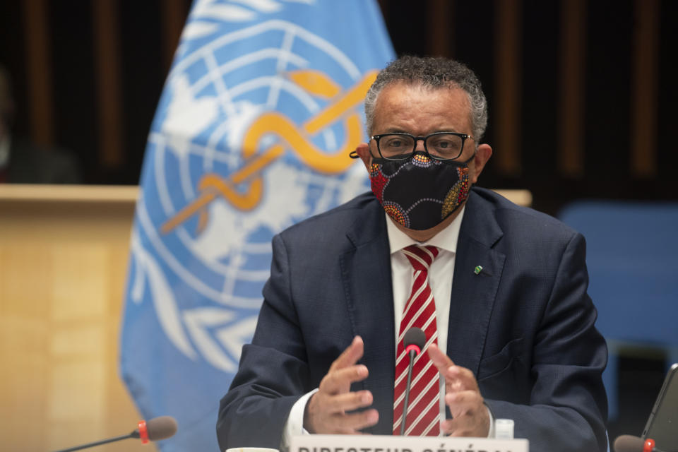 In this photo released by WHO, World Health Organisation on Monday, Oct. 5, 2020, WHO Director-General, Dr Tedros Adhanom Ghebreyesus, wearing a mask to protect against coronavirus, gestures during a special session on the COVID-19 respnse. The head of emergencies at the World Health Organization says its “best estimates” indicate that roughly 1 in 10 people worldwide may have been infected by the coronavirus. (Christopher Black/WHO via AP)