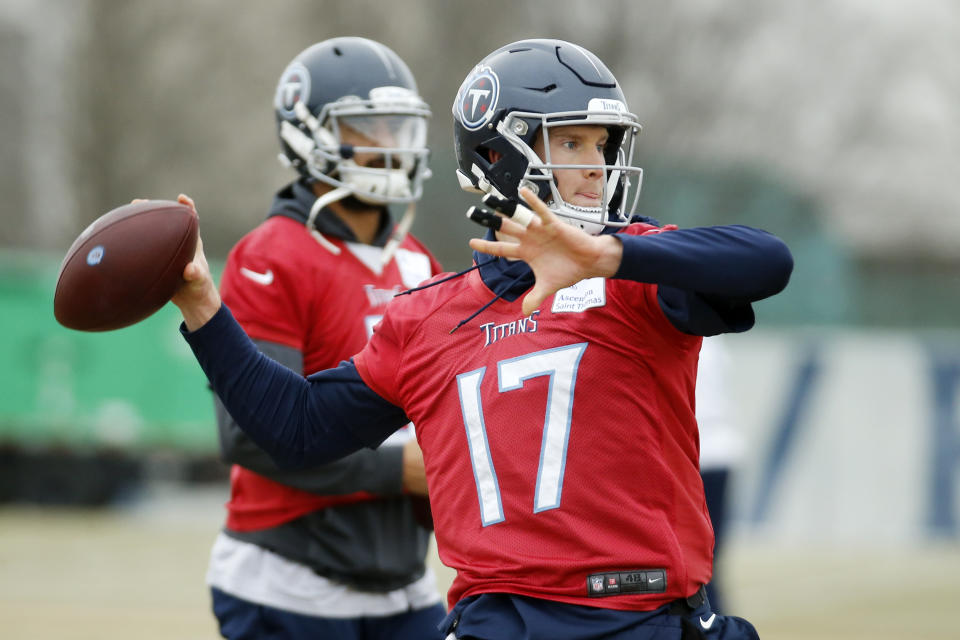 Tennessee Titans quarterback Ryan Tannehill (17) passes during an NFL football practice Friday, Jan. 17, 2020, in Nashville, Tenn. Behind Tannehill is quarterback Marcus Mariota. The Titans are scheduled to face the Kansas City Chiefs in the AFC Championship game Sunday. (AP Photo/Mark Humphrey)
